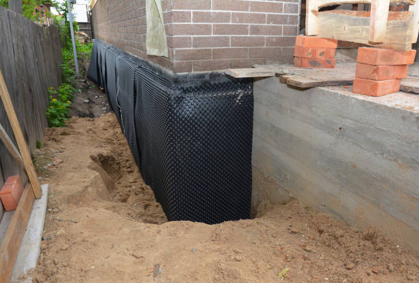 Happy homeowners after waterproofing job in Dearborn Heights